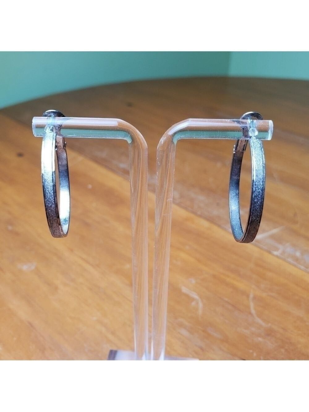 Earrings, flattened silver colored hoops, 1 inch